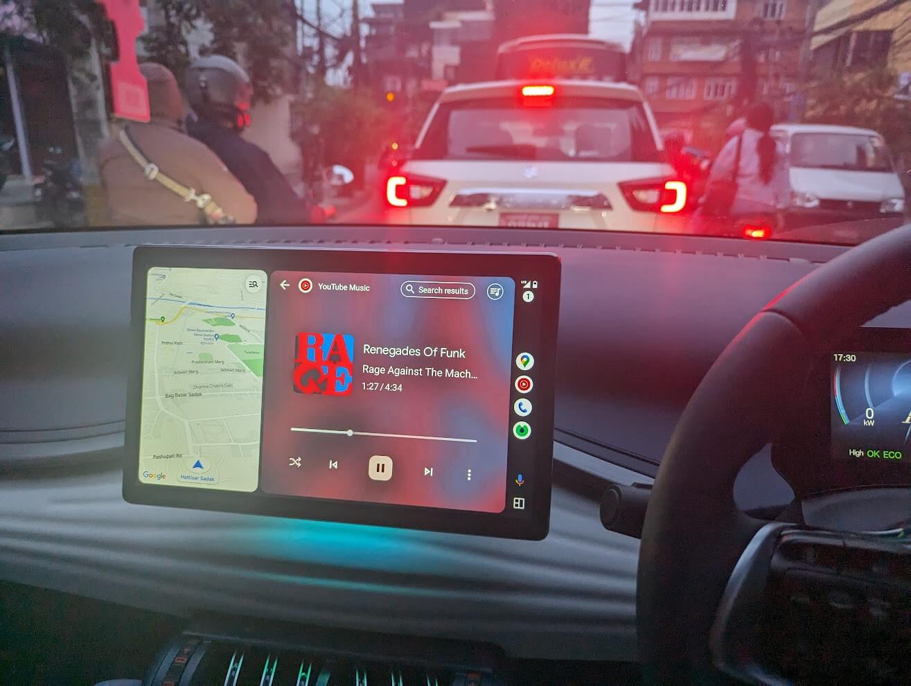 BYD Atto 3 touchscreen running Android Auto with Google Maps and YouTube Music in Kathmandu traffic